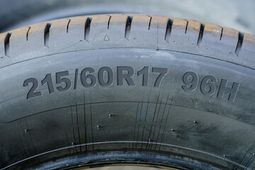 Side view of tire with tire width, height and wheel diameter designation