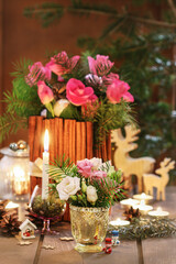 Christmas decorations with flowers, candles and fir.