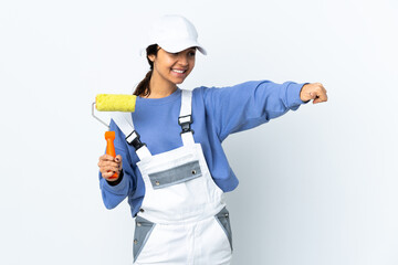 Painter woman over isolated white background giving a thumbs up gesture