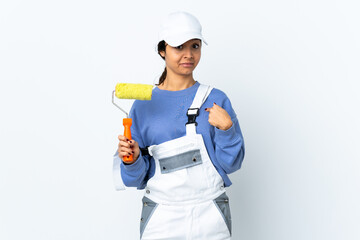 Painter woman over isolated white background with surprise facial expression