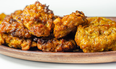 Delicious onion bhaji fritters served on wooden plate as a starter
