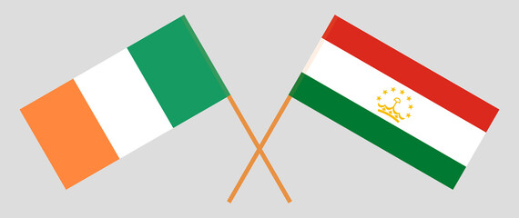 Crossed flags of Ireland and Tajikistan. Official colors. Correct proportion