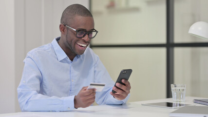 Successful Online Payment on Smartphone by African Man 