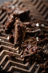 pieces of cake and chocolate on a wooden board. High quality photo