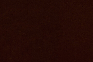 Dark non-uniform paper with spots and inclusions.
