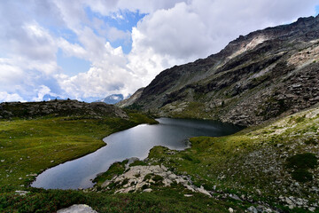 Fototapeta na wymiar Alpine lake in heart of the Alps called Lago Verde