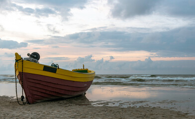 Naklejka na ściany i meble Fishing boat on Polish beach - Debki, Pomerania, Poland