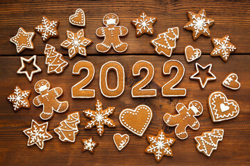 Christmas mosaic homemade gingerbread cookies in the shape of a masked man and numbers of new year