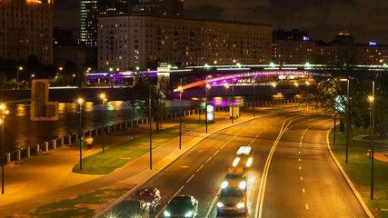 Moscow night road and bridges landscape with green and pink lights
