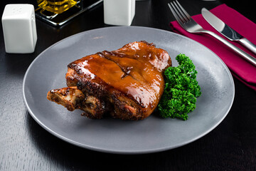 pork knuckle baked in bavarian style, Roasted pork knuckle. Tender and juicy pork wrapped in crispy, garlicky skin. Octoberfest party dinner