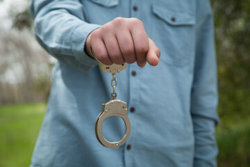 Businessman in handcuffs, criminal concept.
