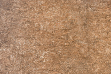 Brown chipboard abstract old pattern surface, dark pressed wood texture, particleboard background