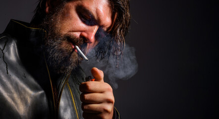 Smoking man. Bearded man lights cigarette. Bad habits. Fashionable guy smoke cigarette. Closeup.