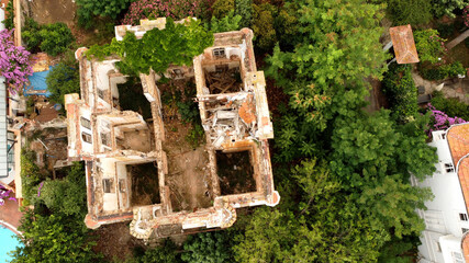 in and outside a destroyed red brick villa on Prinkipo Island, Büyükada in the Sea of Marmara...