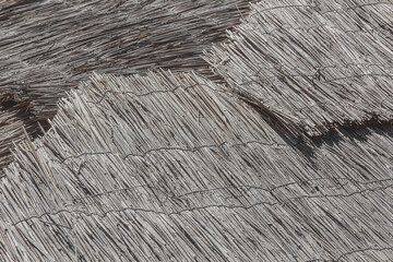 Rural roof made of cane or reeds straw dry background