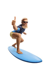 Bearded young man surfing and showing thumbs up - obrazy, fototapety, plakaty
