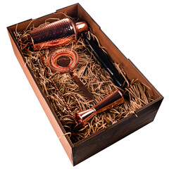 Barman equipment copper Shaker, strainer in a wooden box on white background. Set of bar tools isolated