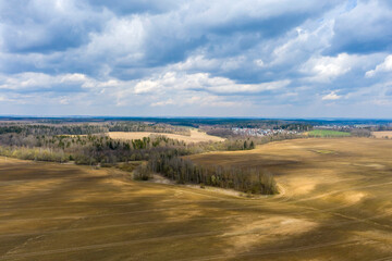 Aerial view of agricultural landscape with fields in spring season.