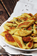 Polish dish kopytka served at the table