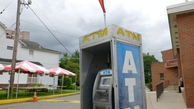 Slow move away from outside ATM machine