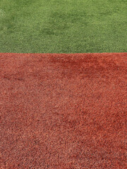 red and green fake grass artificial astroturf sports field ground