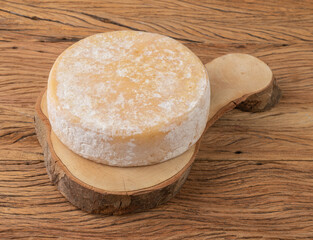 Artisanal Canastra cheese from Minas Gerais, Brazil over wooden table