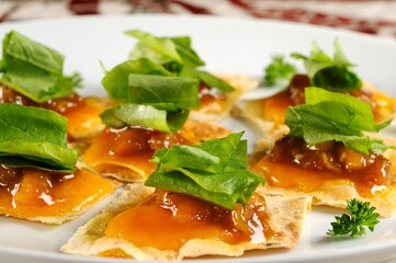 Cheddar crostini with mango chutney and aragula