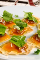 Cheddar crostini with mango chutney and aragula