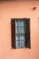 Old style window made of wood on old wall