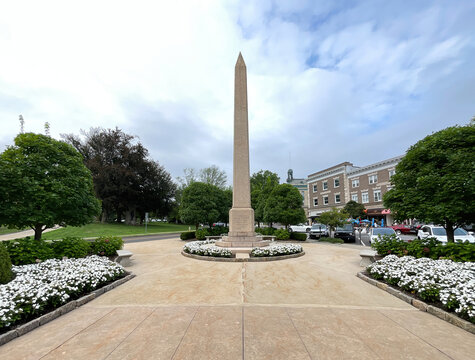 Greenwich, CT - USA - Aug. 29, 2021: Vertical image of Greenwich's  World War I monument, a 50-foot obelisk that sits in a small park off of Greenwich Ave