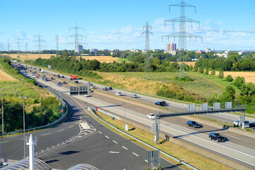 view from observation tower at Taunusblick service station on A5 motorway over Frankfurt skyline, blurred traffic of cars that are driving fast on road expressway in Germany, daytime traffic