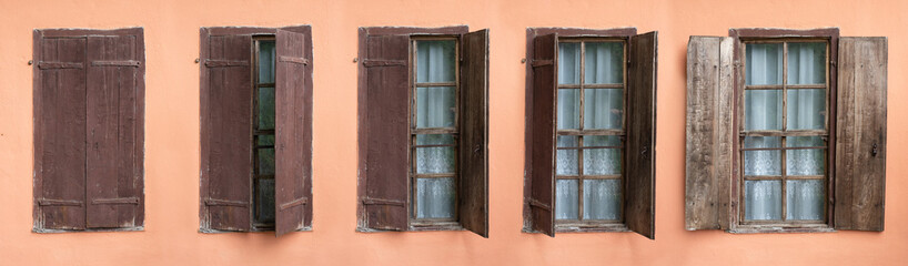 Old style window made of wood on old wall