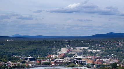 small city in the forest Sherbrooke downtown Eastern Townships clouds and traffic