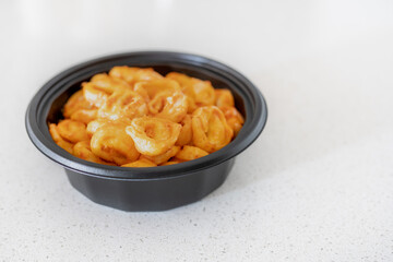 Tasty tortellini with tomato rosa sauce. Pasta time. Shallow depth of field.