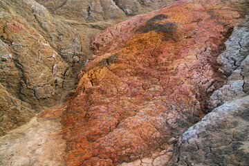 The clay quarry resembles a cosmic landscape.Ural Mars.Top view of the hills made of refractory colored clay.