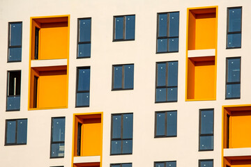 Fototapeta premium Facade of a new multi-story residential building. architecture and modern construction