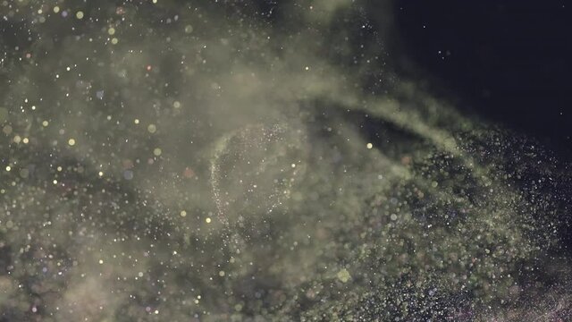 The sparkling particles falling in the air. slow motion