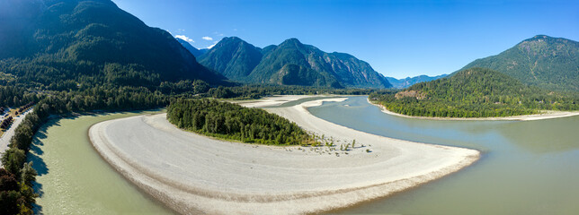 Panorama format photo of the Fraser river in Hope, British Columbia, Canada - obrazy, fototapety, plakaty
