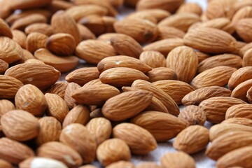 Heap of Whole almond seeds.