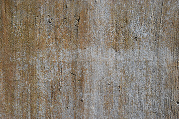Close up abstract detail of concrete block wall with weathered plaster rendering effect
