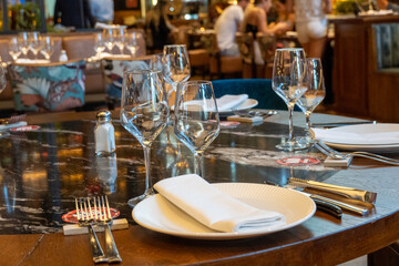 Wooden table with cutlery in a restaurant