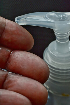 Closeup applying hand sanitizer to fingers