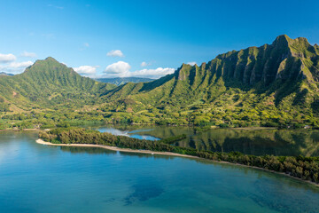 Aerial view of the ancient Moli'i fishponds with reflections of the Koolau mountains in the ponds....