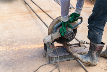 Worker are using Fiber cutting platform tools to cut steel for construction.