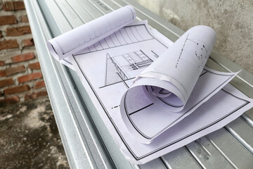 rolled up blueprints