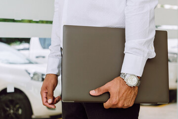 close-up view of a businessman with his lap top in hand