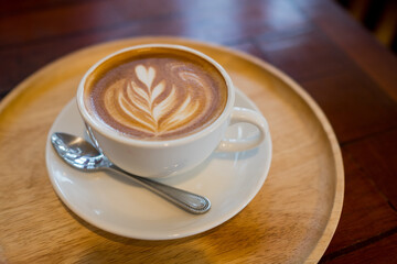 hot latte art coffee on wood table, relax time
