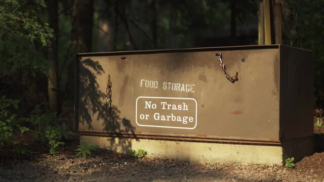 Food storage locker at a campsite in Glacier National Park. The lockers are animal proof and help prevent bear and other animal attacks. Locked off static shot. 