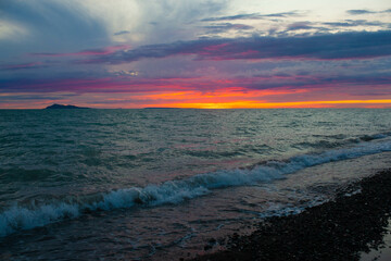 Fototapeta na wymiar Amazing sunset on Lake Alakol in Kazakhstan.