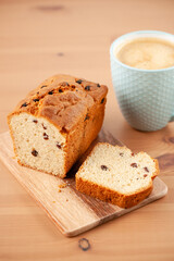 Fresh cake with cup of coffee on wooden table